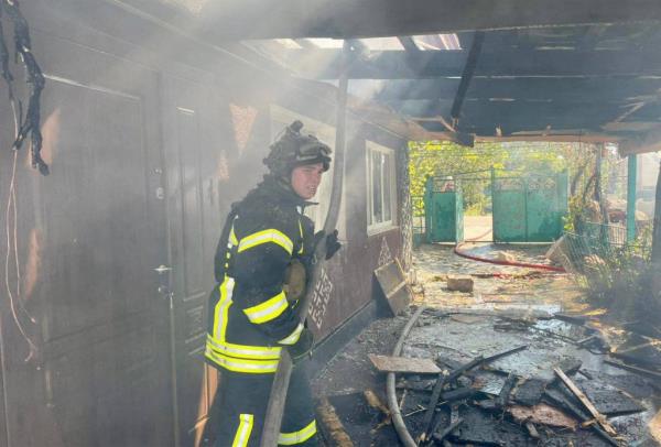  Ukrainian firefighters are seen putting out blazes caused by renewed Kremlin shellings Sunday.  