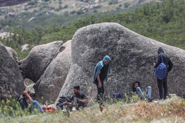 Migrants from Turkey wait in a makeshift camp after crossing the border into Jacumba Hot Springs, California.