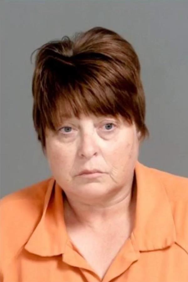 Surveillance video from the jail allegedly showed Leyrer pass more than 100 fentanyl pills to an inmate inside a folder while they sat at a table during a lesson one day. 