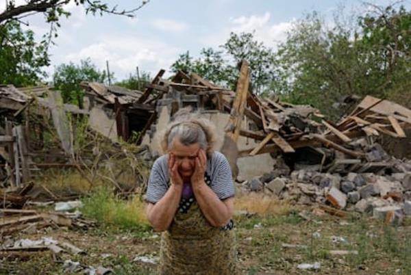 Valentina Chernaya, 90, mourns the damage her house suffered from a bombing raid on Rozivka, Do<em></em>netsk region, Ukraine, on June 3, 2024. 