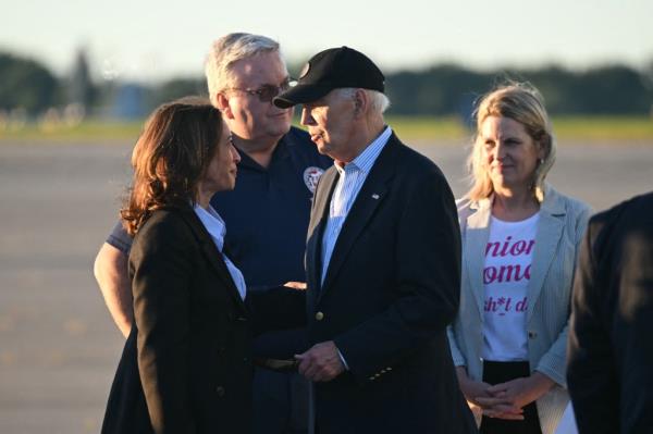 US Vice President and Democratic presidential candidate Kamala Harris (L) speaks to US President Joe Biden before boarding Air Force Two to departing Pittsburgh Internatio<em></em>nal Airport in Pittsburgh, Pennsylvania, on September 2, 2024. 
