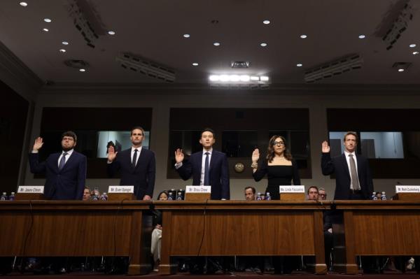 Social media companies' CEOs being sworn in before a Senate panel.