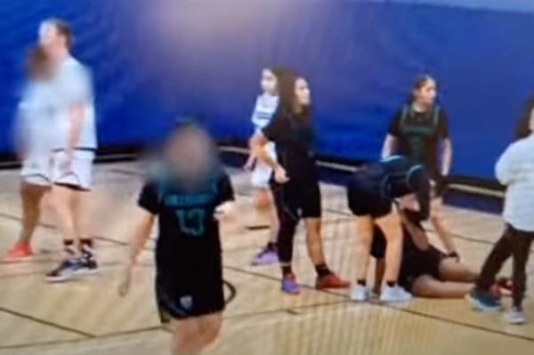 Teammates are seen caring for their injured colleague.