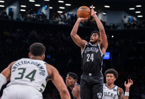 Cam Thomas shoots a 3-pointer during the Nets' loss to the Bucks.