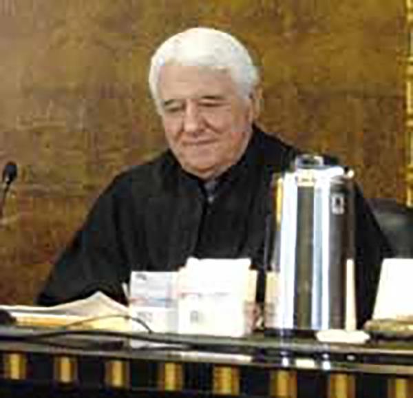 Judge Thomas James McAvoy sitting at a desk