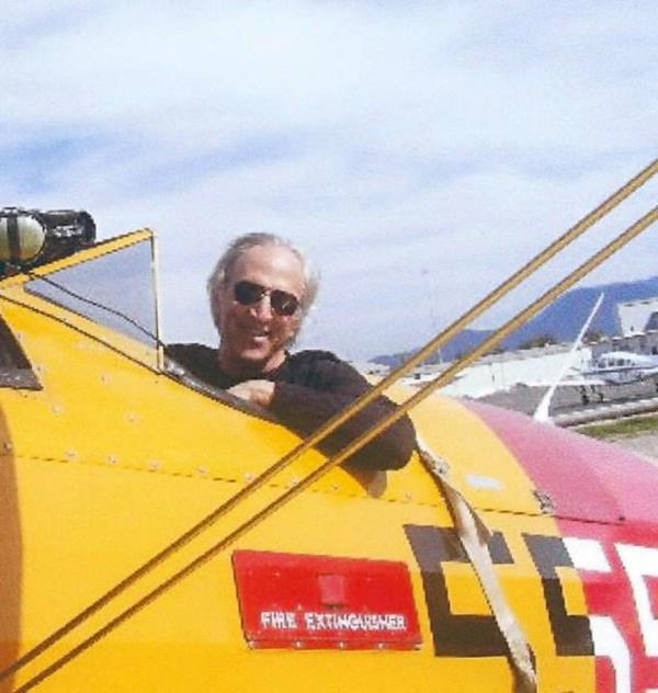 Randolph Sherman in the cockpit of a plane. 