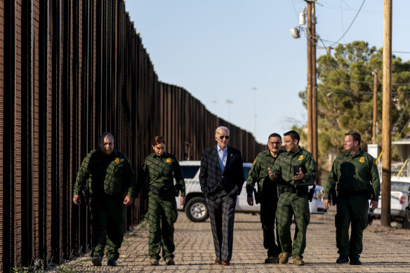 President Joe Biden talks with US Border Patrol agents as they walk along a stretch of the U.S.-Mexico border in El Paso Texas in 2023