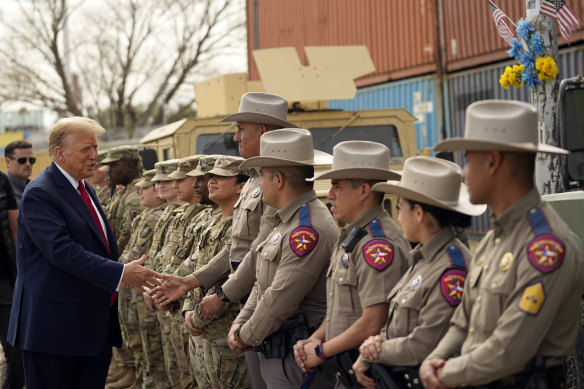 Do<em></em>nald Trump greets members of Texas Department of Public Safety as he visits Shelby Park on the US-Mexico border.