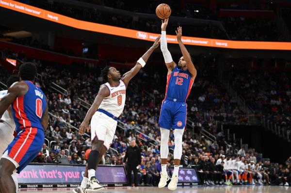 Detroit Pistons forward Tobias Harris (12) shoots the ball over New York Knicks forward OG Anunoby (8) in the first quarter at Little Caesars Arena.