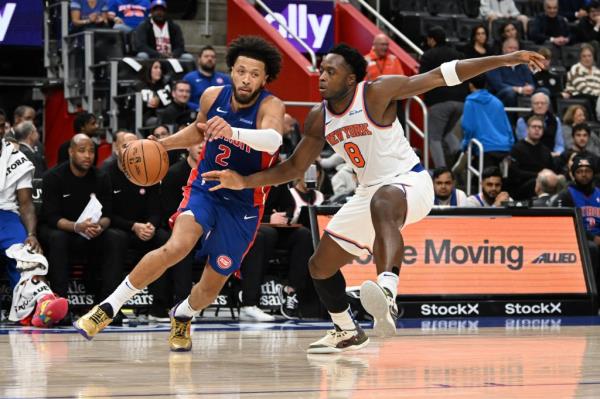 Detroit Pistons guard Cade Cunningham (2) drives past New York Knicks forward OG Anunoby (8)  in the second quarter at Little Caesars Arena.