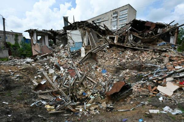 This photograph shows a destroyed house in the town of Kupiansk, Kharkiv region, on May 26, 2023