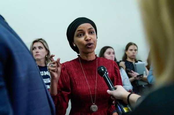 Representative Ilhan Omar, Democrat of Minnesota, speaks to reporters in the hallway outside a House Committee on Education and the Workforce hearing 
