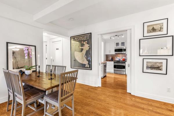 A view of Lorde's layout, with a dining space under a beamed ceiling.