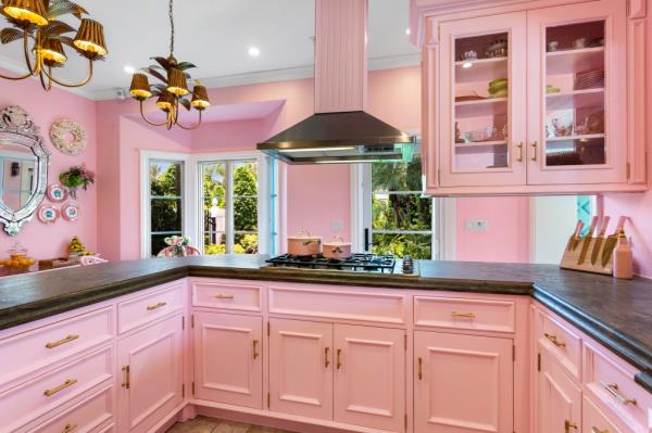 Inside, the home has a Barbie-pink kitchen.