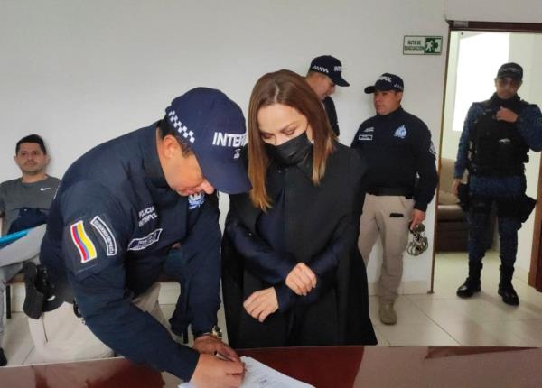Go<em></em>nzalez had her fingerprints taken before boarding the extradition flight with Interpol.