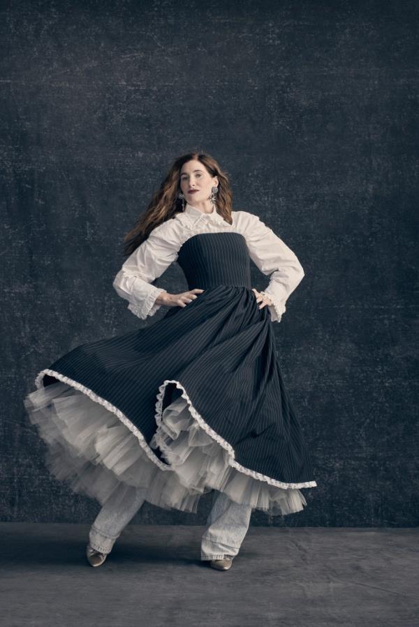 Kathryn Hahn dancing in a gown.