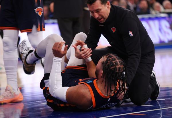 Jalen Brunson is helped off the ground after getting punched in the face during a game against the Pacers earlier this season. A foul wasn't call on the play.