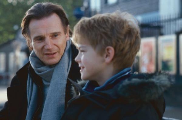 Liam Neeson and Thomas Sangsterplaying a father and son in the film Love Actually