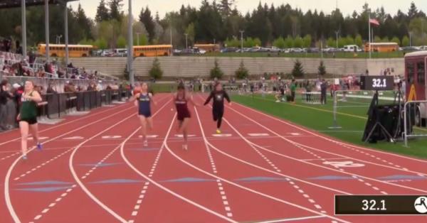 The other athletes are seen crossing the finish line.