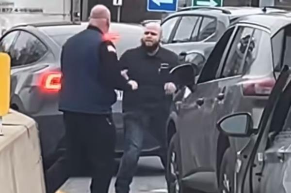 Both men separated from each other for a second before the taller fighter charged at the other man while each swung toward the other's face several times.