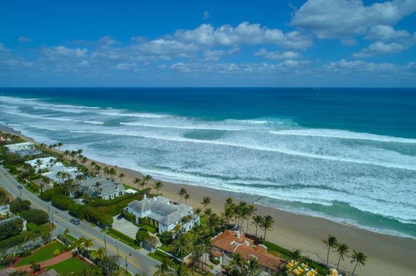 Aerial drone image of Palm Beach Florida rich mansions on the beach