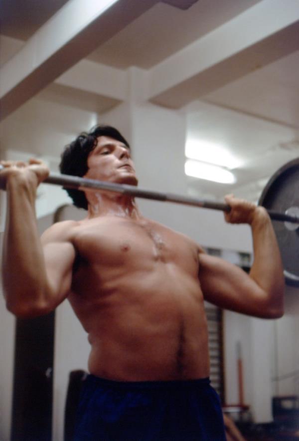 Christopher Reeve lifting a weight when he was 24. 