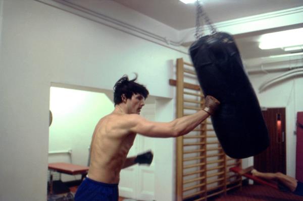 Christopher Reeve with a punching bag. 