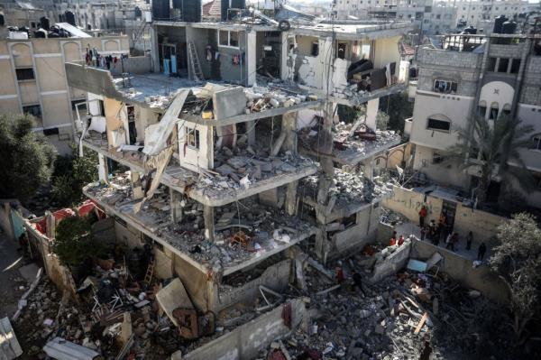 Palestinians search the rubble of homes destroyed by an overnight Israeli bombardment in Rafah in the southern Gaza Strip on Monday, March 25, 2024. 