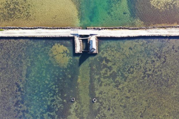 The type of fishpond modeled in the study is called a loko kuapā, or walled fishpond, wher<em></em>e a boundary rock wall encloses part of the ocean at the mouth of a nutrient-rich stream. 