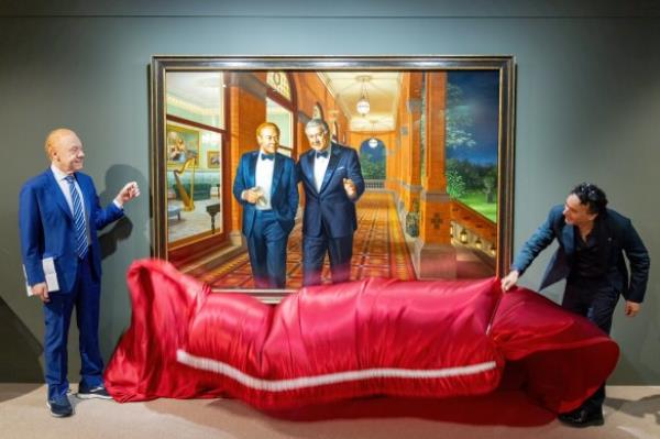 Anthony Pratt (left) and artist Ralph Heimans unveil a portrait of Pratt and his late father Richard, at Visy headquarters in Melbourne.