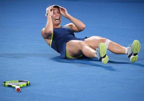 Denmark's Caroline Wozniacki celebrates after defeating Romania's Simona Halep in the women's singles final at the Australian Open tennis champio<em></em>nships in Melbourne, Australia, Saturday, Jan. 27, 2018. 