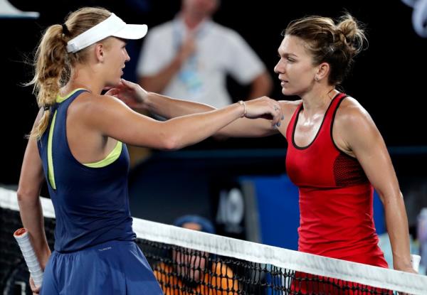 Denmark's Caroline Wozniacki, left, is co<em></em>ngratulated by Romania's Simona Halep after winning the women's singles final at the Australian Open tennis champio<em></em>nships in Melbourne, Australia, Saturday, Jan. 27, 2018. 