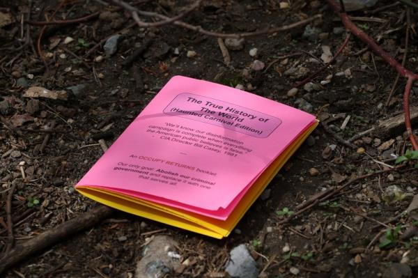 A view of a pamphlet dropped by a person that was covered in flames outside the courthouse 