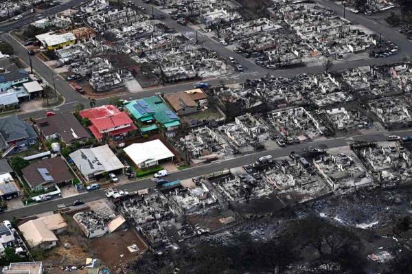 Dozens of destroyed homes and buildings burned to the ground in Lahaina, in the aftermath of wildfires in western Maui, Hawaii.