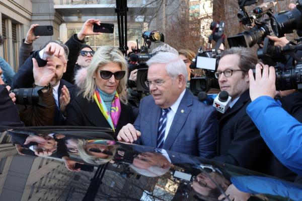 Senator Bob Menendez and his wife Nadine standing outside a Manhattan court, New York City, after their arraignment on charges in a federal bribery case.