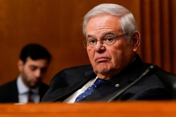 U.S. Senator Bob Menendez in a suit and tie attending a Senate Finance Committee hearing on the 2025 budget at Capitol Hill.