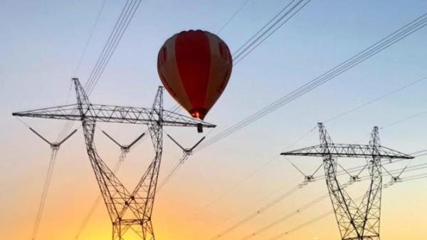 A hot-air balloon became tangled in power lines above a highway in rural NSW. Stock image.