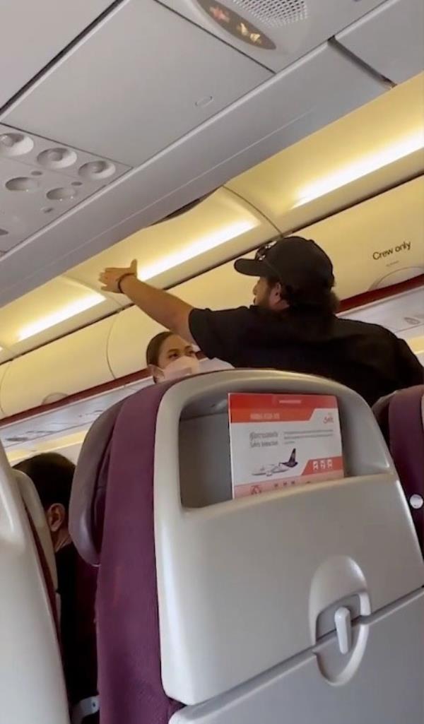 Pictured is an angry passenger shouting toward the cockpit.