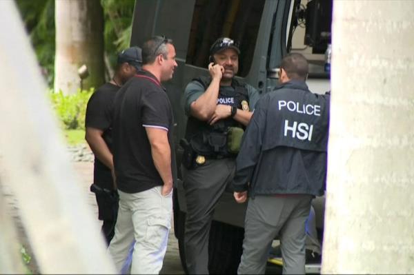 MIAMI BEACH, FLORIDA - U.S. authorities are seen outside the home of Sean 