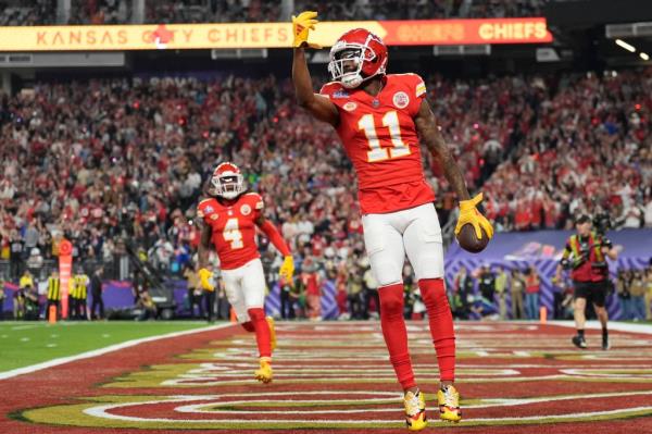 Kansas City Chiefs player Valdes-Scantling holding football celebrating touchdown against San Francisco 49ers (AP Photo/Ashley Landis).