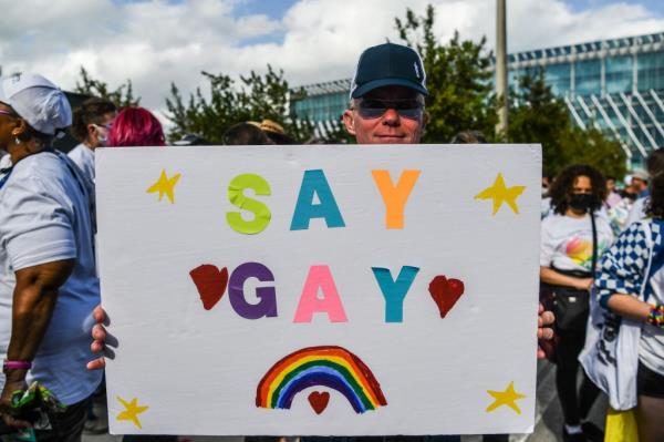 Members and supporters of the LGBTQ community attend the 
