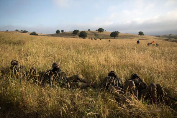 In this 2014 photo, Israeli soldiers in the Netzah Yehuda battalion are seen taking part in their annual training in the Israeli-co<em></em>ntrolled Golan Heights, near the Syrian border.