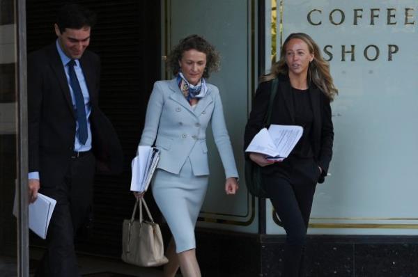 Jillian Caldwell (centre), a lawyer for sacked CFMEU NSW boss Darren Greenfield, leaves Downing Centre Local Court on Tuesday morning.