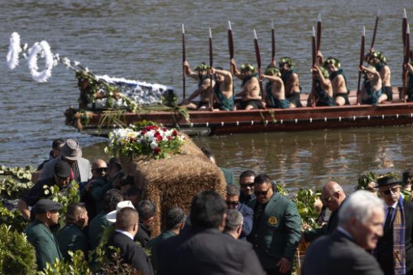 The coffin with the body of New Zealand’s Maori King, Kiingi Tuheitia Pootatau Te Wherowhero VII, is carried after being transported on a waka (a traditio<em></em>nal canoe) for burial in Ngaruawahia.