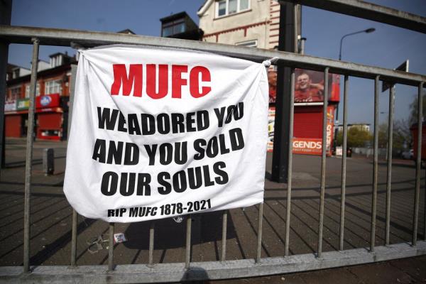Manchester United fans protested against the club’s plans to join the European Super League in April 2021 (Martin Rickett/PA)