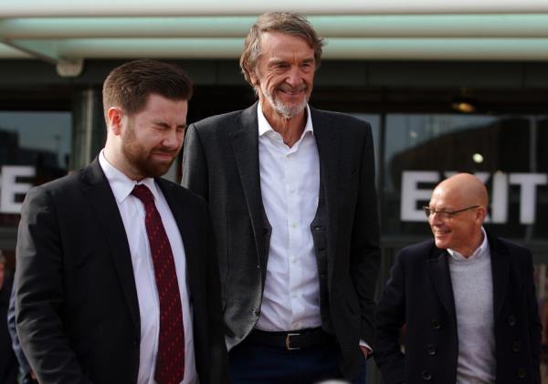 Sir Jim Ratcliffe (centre) is set to purchase a 25 per cent stake in Manchester United (Peter Byrne/PA)