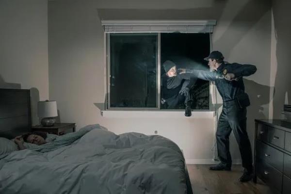 burglars breaking into a bedroom