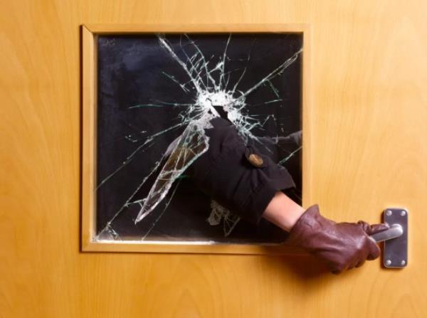 burglar breaking into someone's home