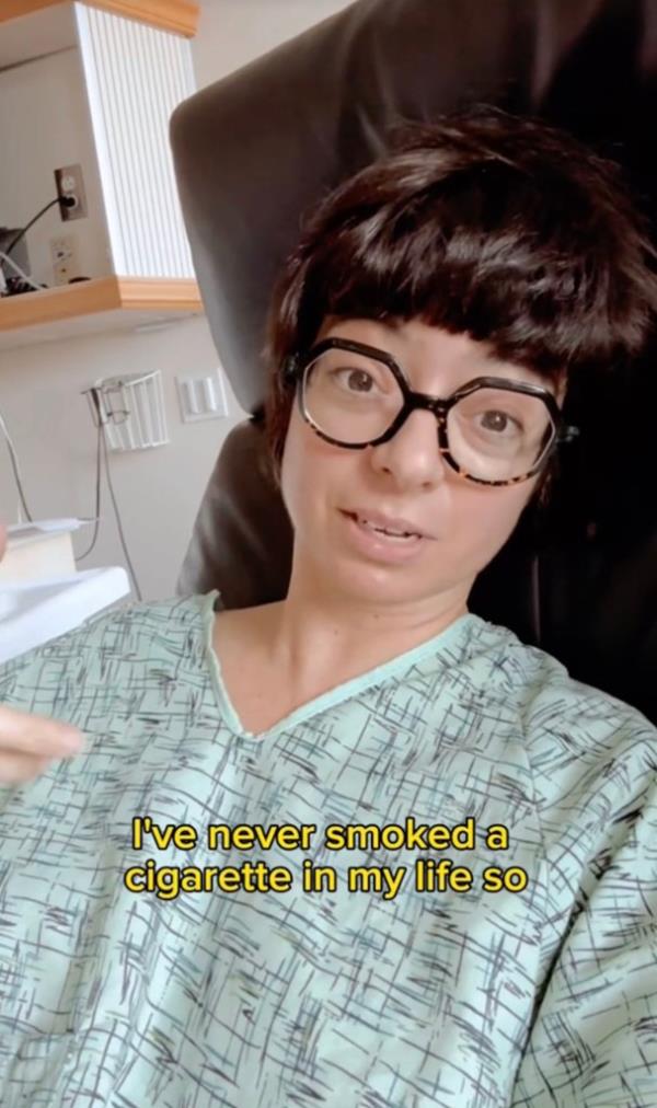 Kate Micucci in a hospital gown. 