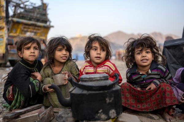 Afghan refugees settle in a camp near the Torkham Pakistan-Afghanistan border in Torkham, Afghanistan, Saturday.